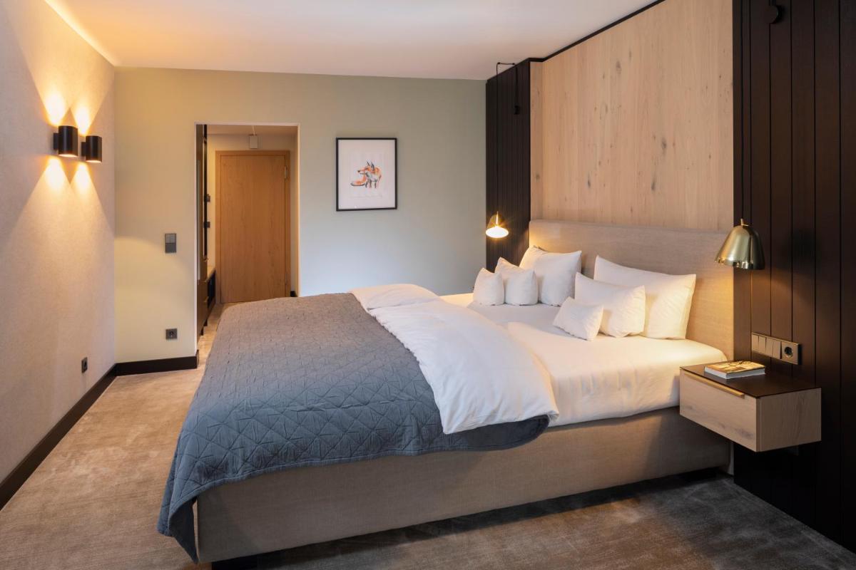 Ein Bett oder Betten in einem Zimmer der Unterkunft Wellness & Genuss Resort - Engel Obertal