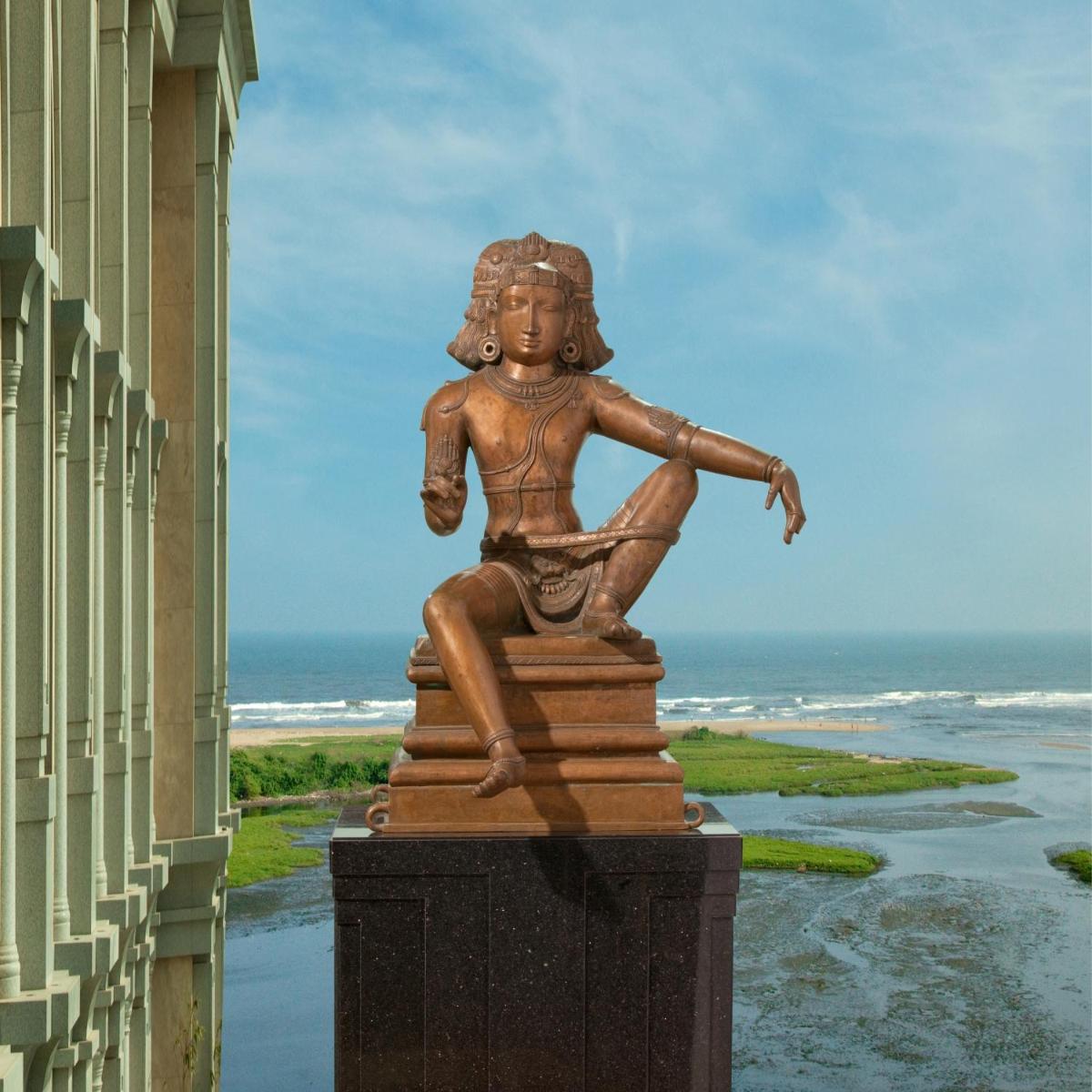 a statue of a little girl sitting on a pile of books at The Leela Palace Chennai in Chennai a statue of a little girl sitting on a pile of books at The Leela Palace Chennai in Chennai