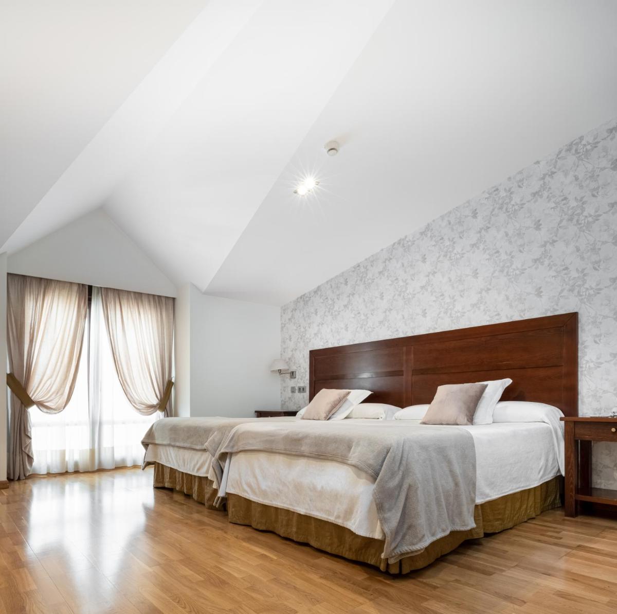 Cama o camas de una habitación en Hotel Villa Virginia