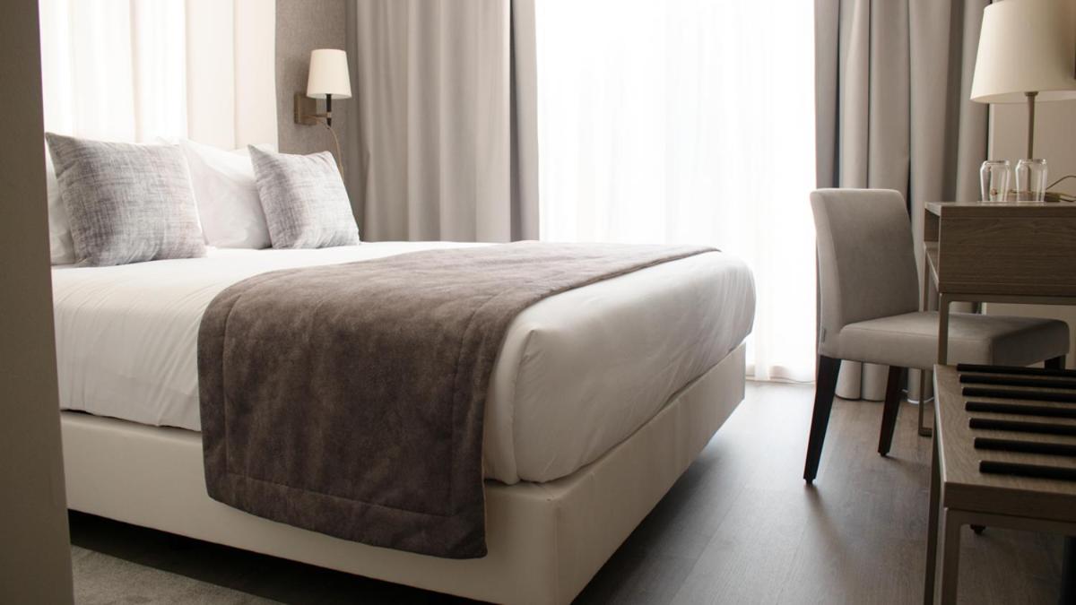 Uma cama ou camas num quarto em MASA Hotel & Spa Campo Grande Collection