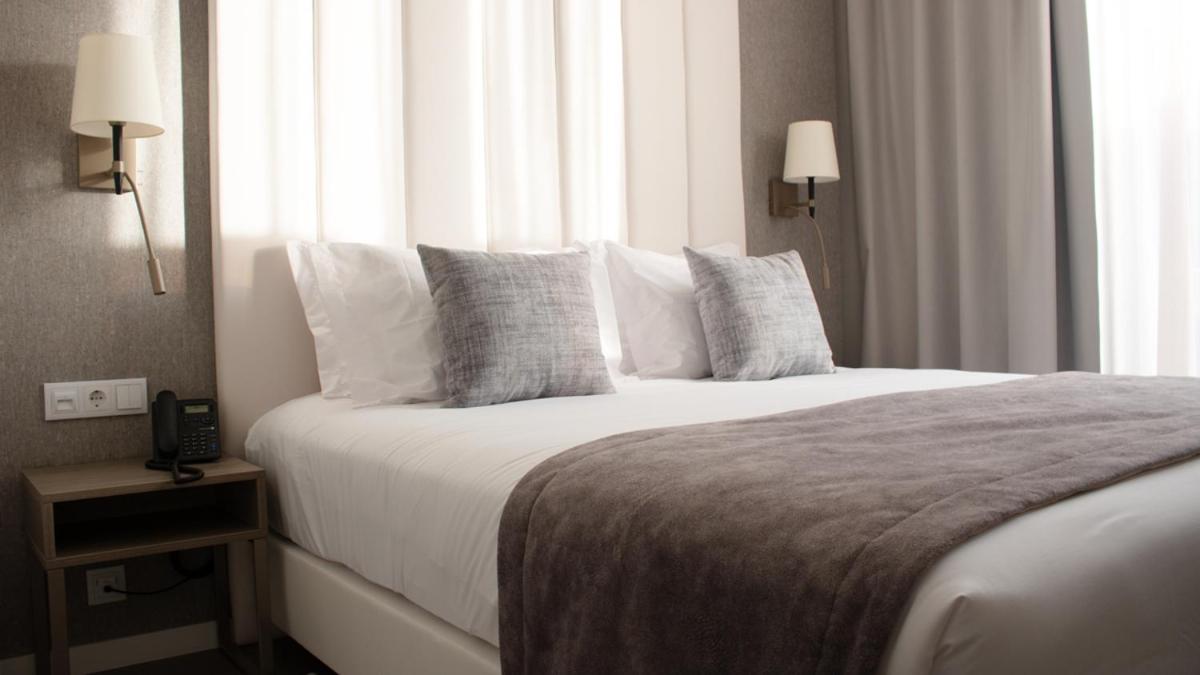 Uma cama ou camas num quarto em MASA Hotel & Spa Campo Grande Collection