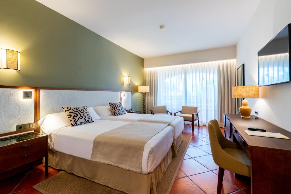 Cama o camas de una habitación en Puerto Antilla Grand Hotel