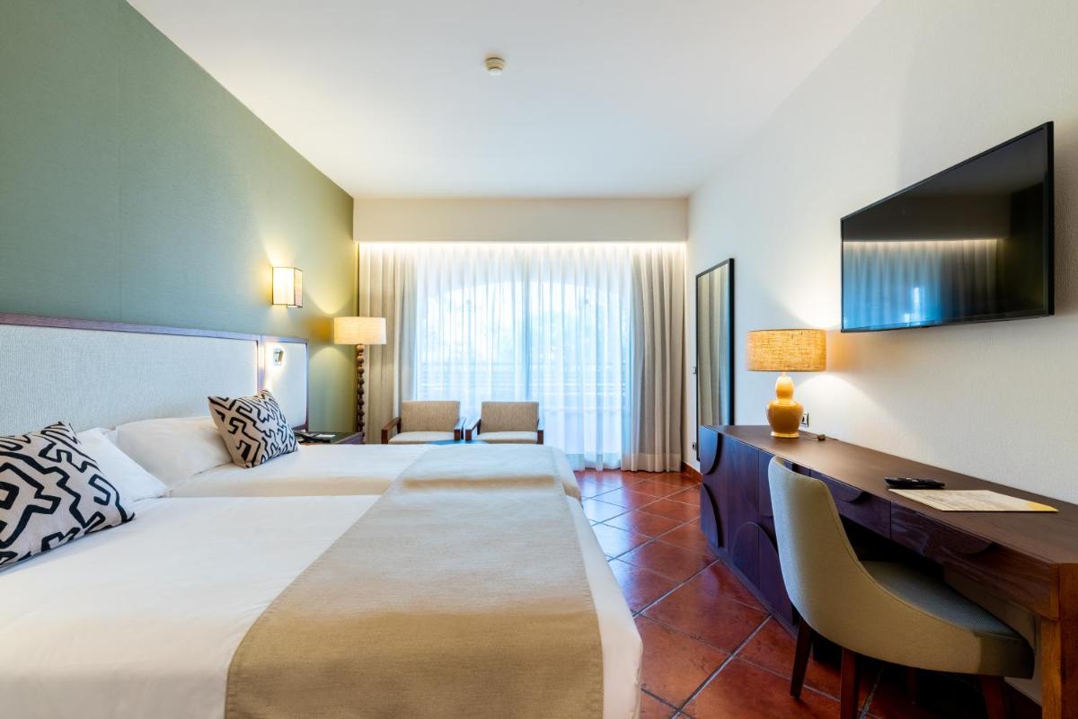 Cama o camas de una habitación en Puerto Antilla Grand Hotel