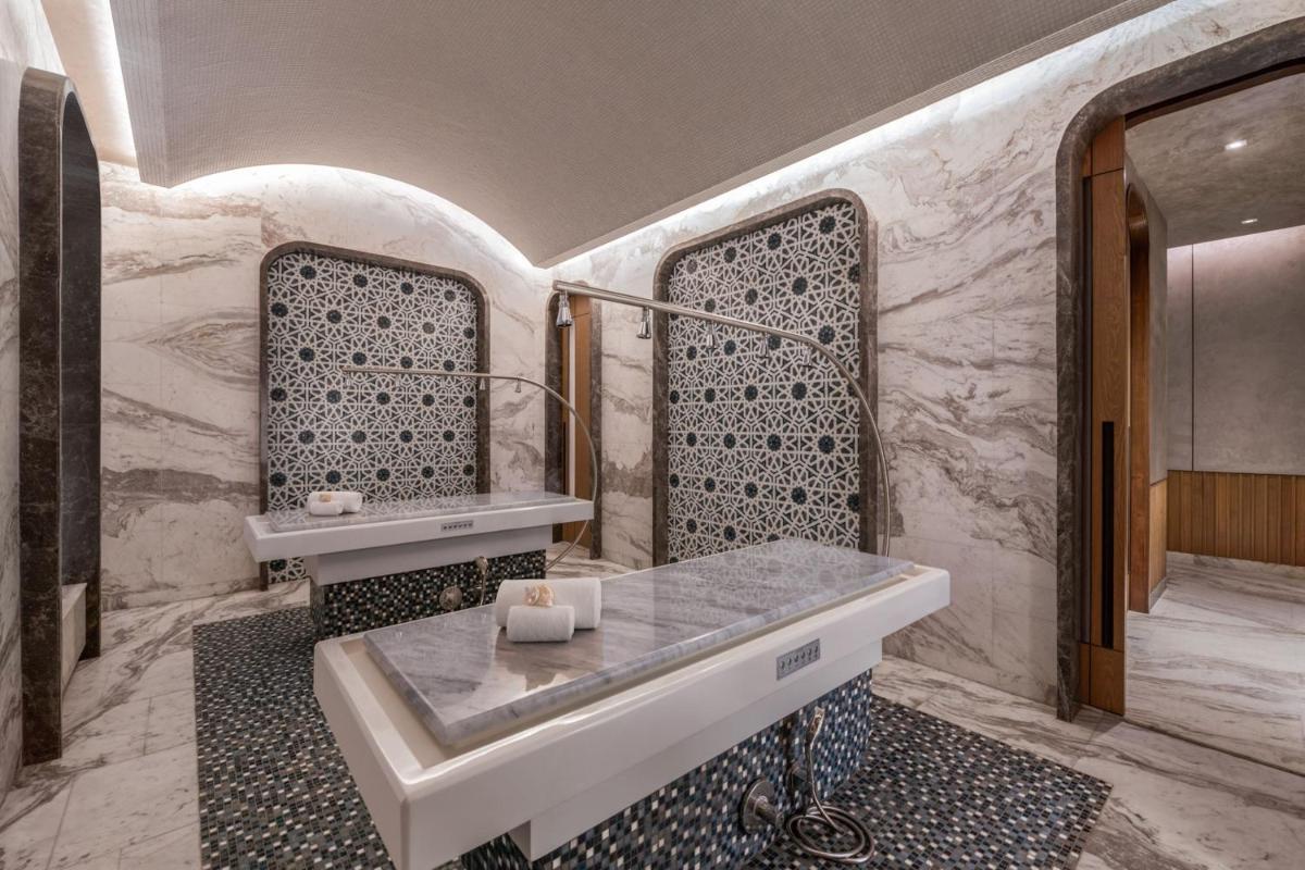 a bathroom with a tub and a sink at JW Marriott Goa in Vagator a bathroom with a tub and a sink at JW Marriott Goa in Vagator