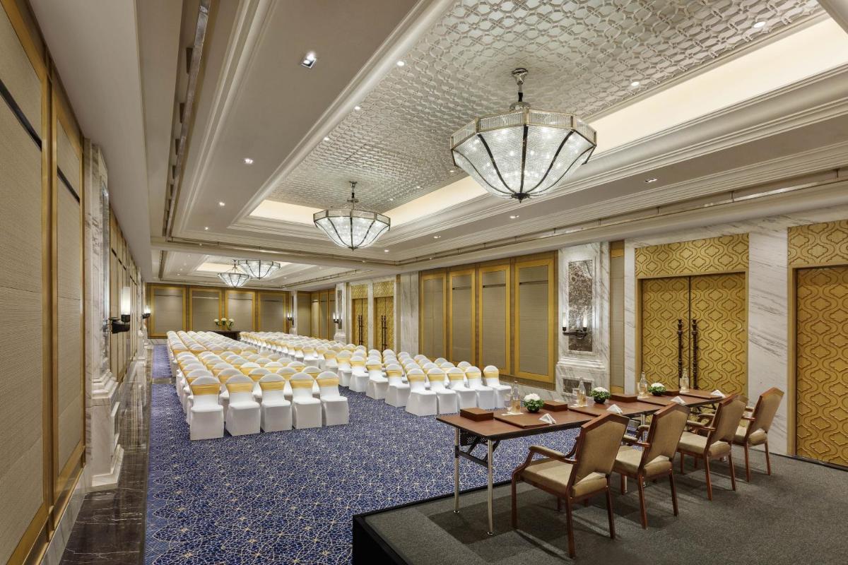 a banquet hall with tables and chairs and chandeliers at ITC Royal Bengal, a Luxury Collection Hotel, Kolkata in Kolkata +29 photos