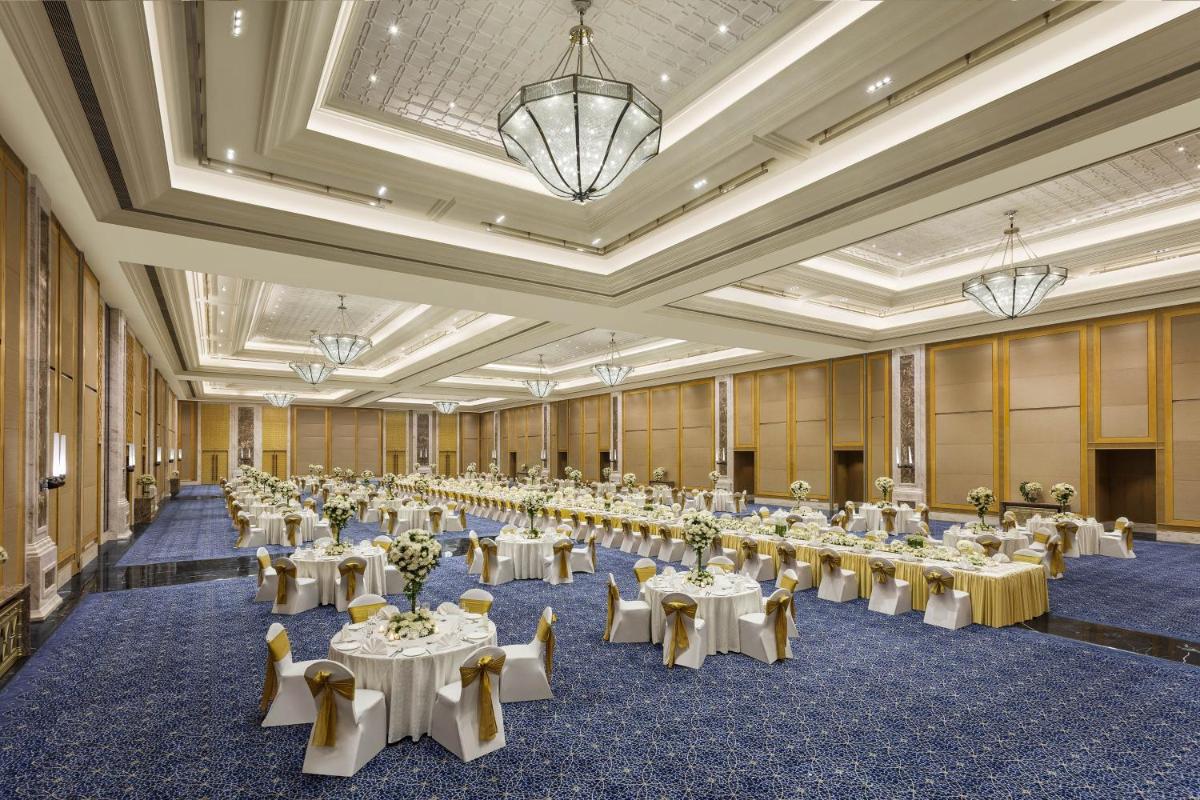 a large banquet hall with tables and chairs at ITC Royal Bengal, a Luxury Collection Hotel, Kolkata in Kolkata
