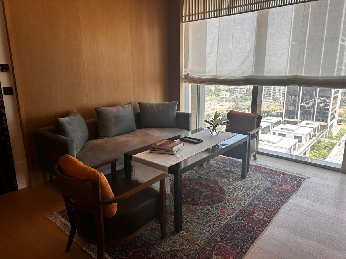 a living room with a couch and a table at Grand Hyatt Gurgaon in Gurgaon