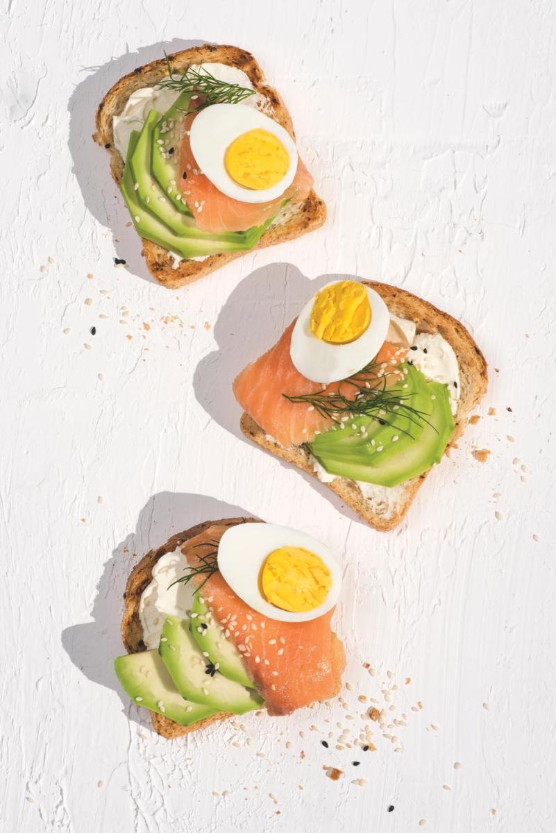 three pieces of toast with eggs and vegetables on it at JW Marriott Mumbai Juhu in Mumbai