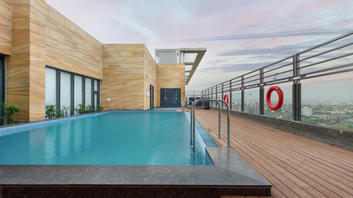 a swimming pool on the roof of a building at Holiday Inn Gurugram Sector 90 by IHG in Gurgaon