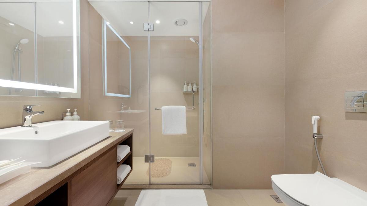 a bathroom with a sink and a shower at Holiday Inn Gurugram Sector 90 by IHG in Gurgaon