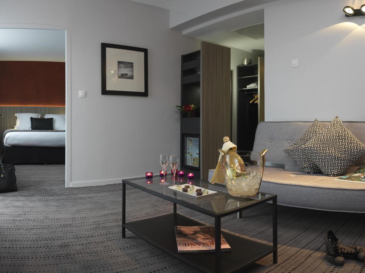 Un ou plusieurs lits dans un hébergement de l'établissement Best Western Plus Hôtel & Spa de Chassieu