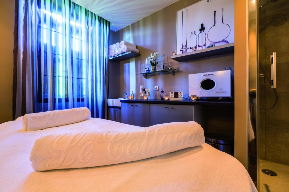 Un ou plusieurs lits dans un hébergement de l'établissement Hotel Le Cottage Bise