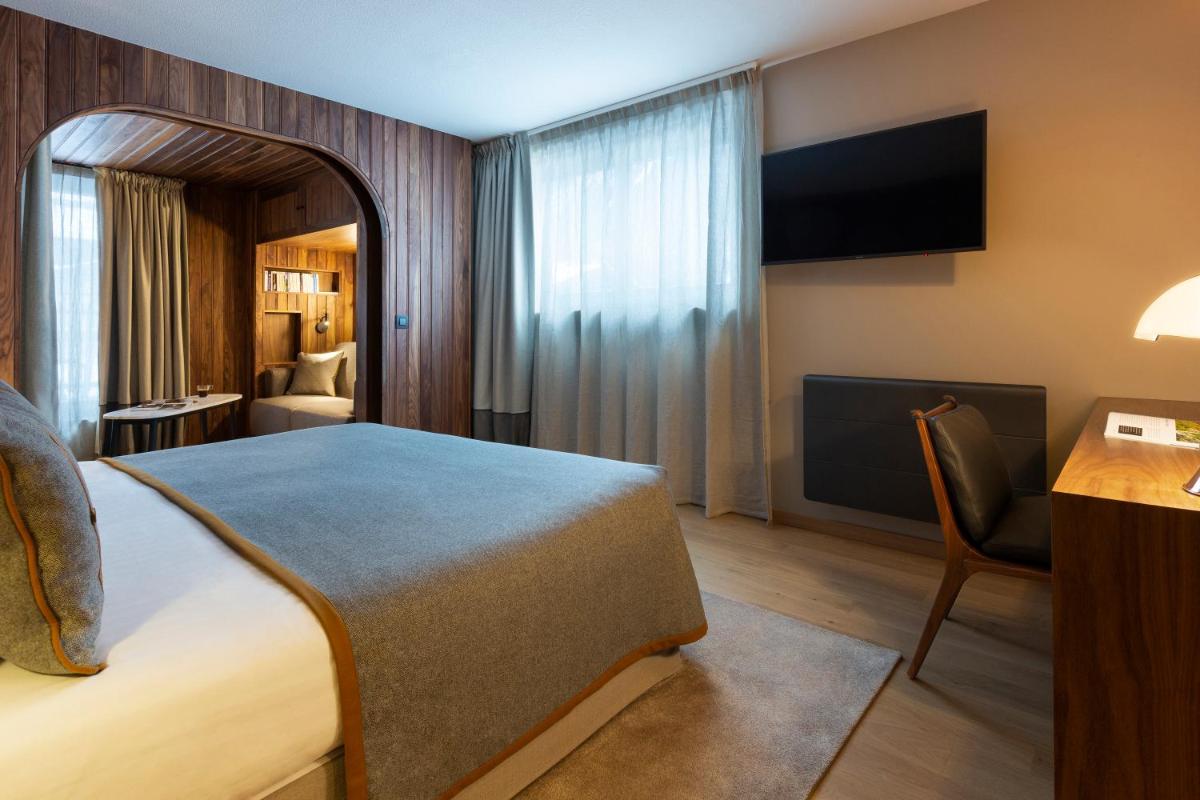 Un ou plusieurs lits dans un hébergement de l'établissement Heliopic Hotel & Spa