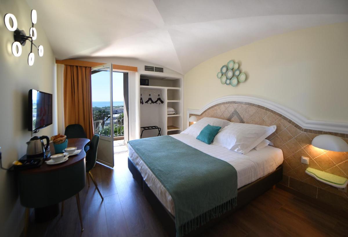 Un ou plusieurs lits dans un hébergement de l'établissement Ostella Spa & Resort