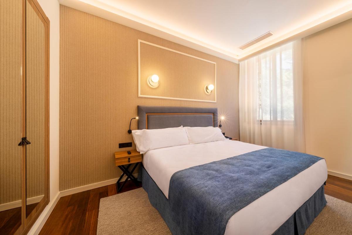 Cama o camas de una habitación en Iberik Gran Balneario de Guitiriz