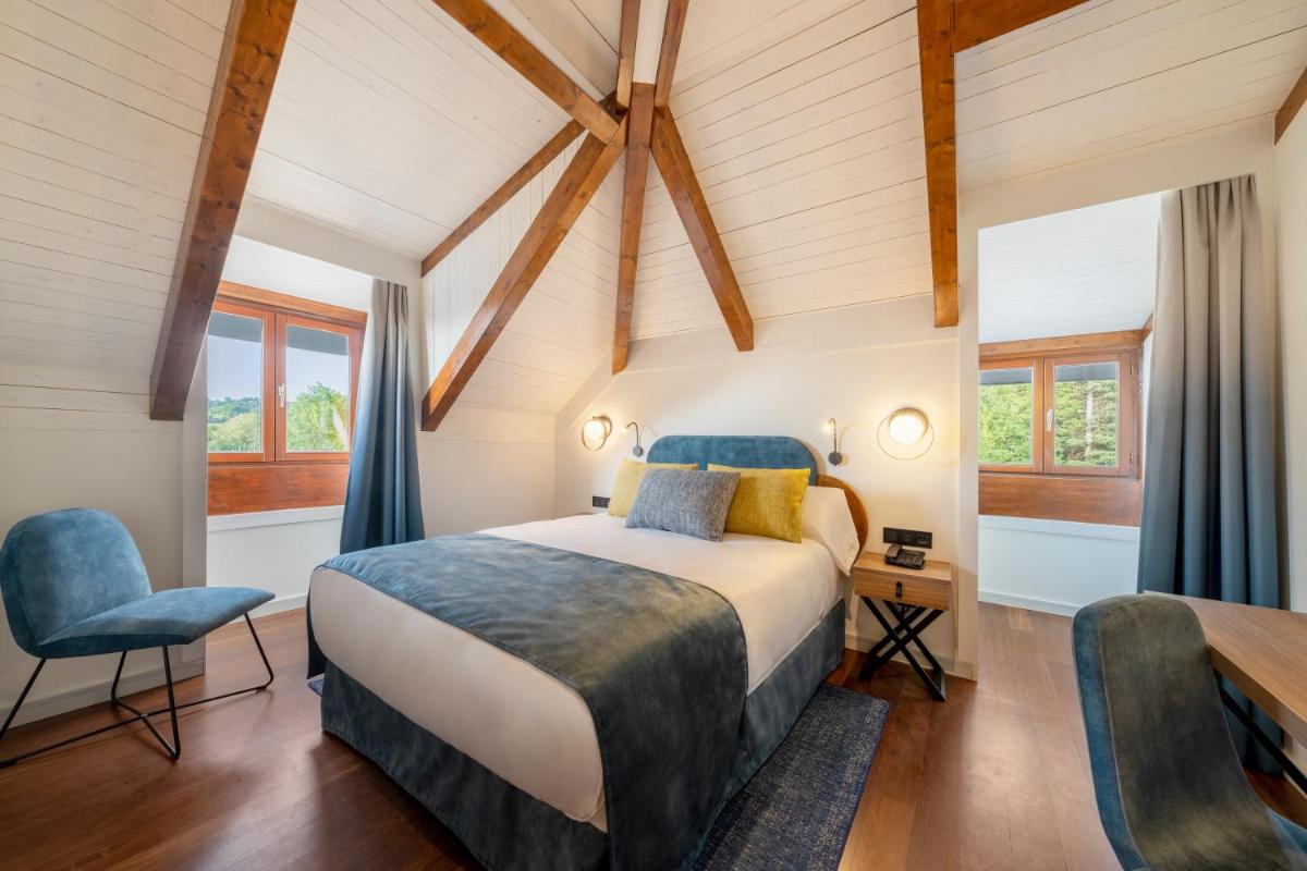 Cama o camas de una habitación en Iberik Gran Balneario de Guitiriz