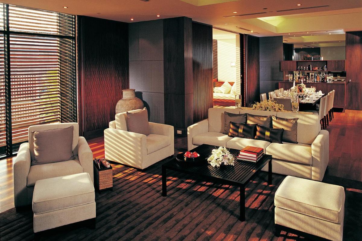 a living room with white furniture and a table at ITC Sonar, a Luxury Collection Hotel, Kolkata in Kolkata