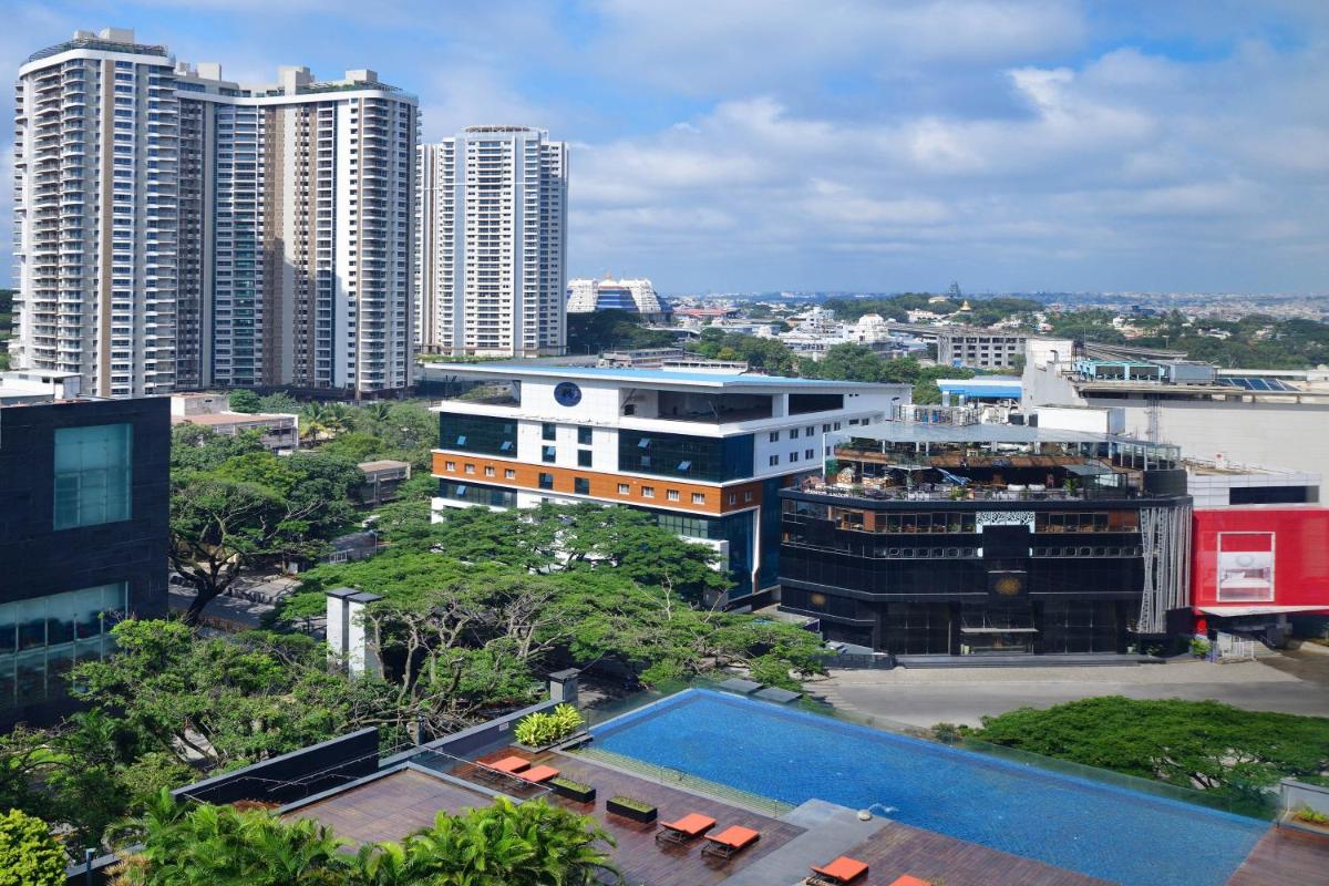 a view of a city with tall buildings and a pool at Sheraton Grand Bangalore Hotel at Brigade Gateway in Bengaluru