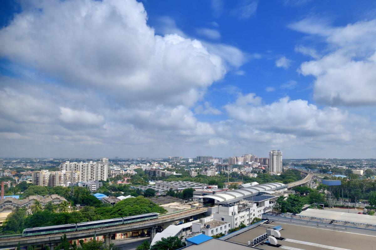 a view of a city with a train at Sheraton Grand Bangalore Hotel at Brigade Gateway in Bengaluru