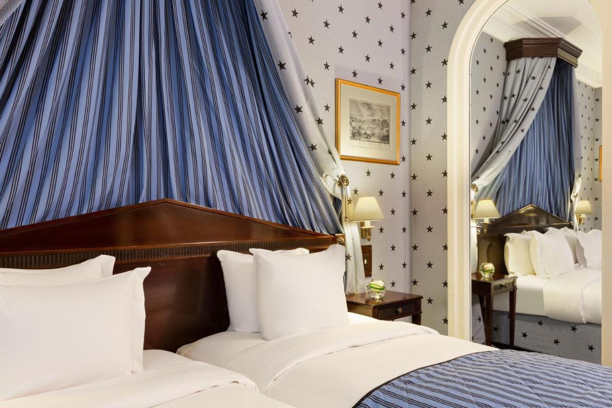 Un ou plusieurs lits dans un hébergement de l'établissement Le Dokhan's Paris Arc de Triomphe, a Tribute Portfolio Hotel