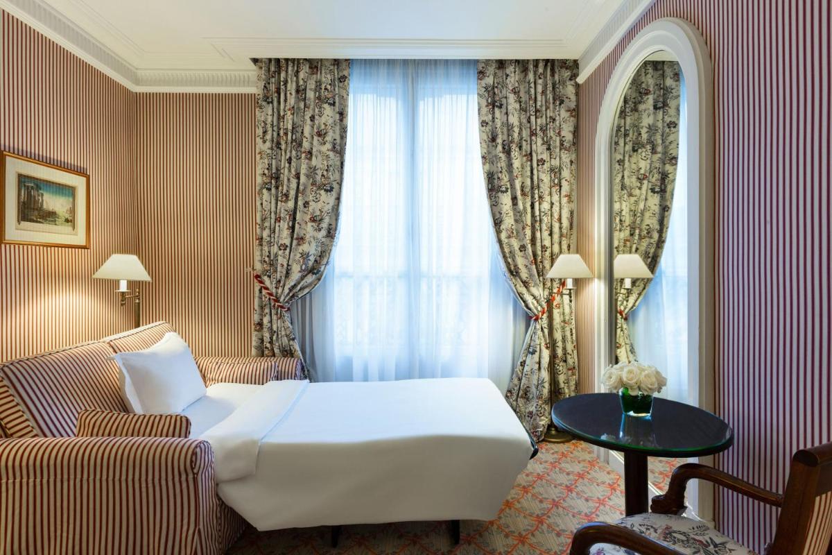 Un ou plusieurs lits dans un hébergement de l'établissement Le Dokhan's Paris Arc de Triomphe, a Tribute Portfolio Hotel