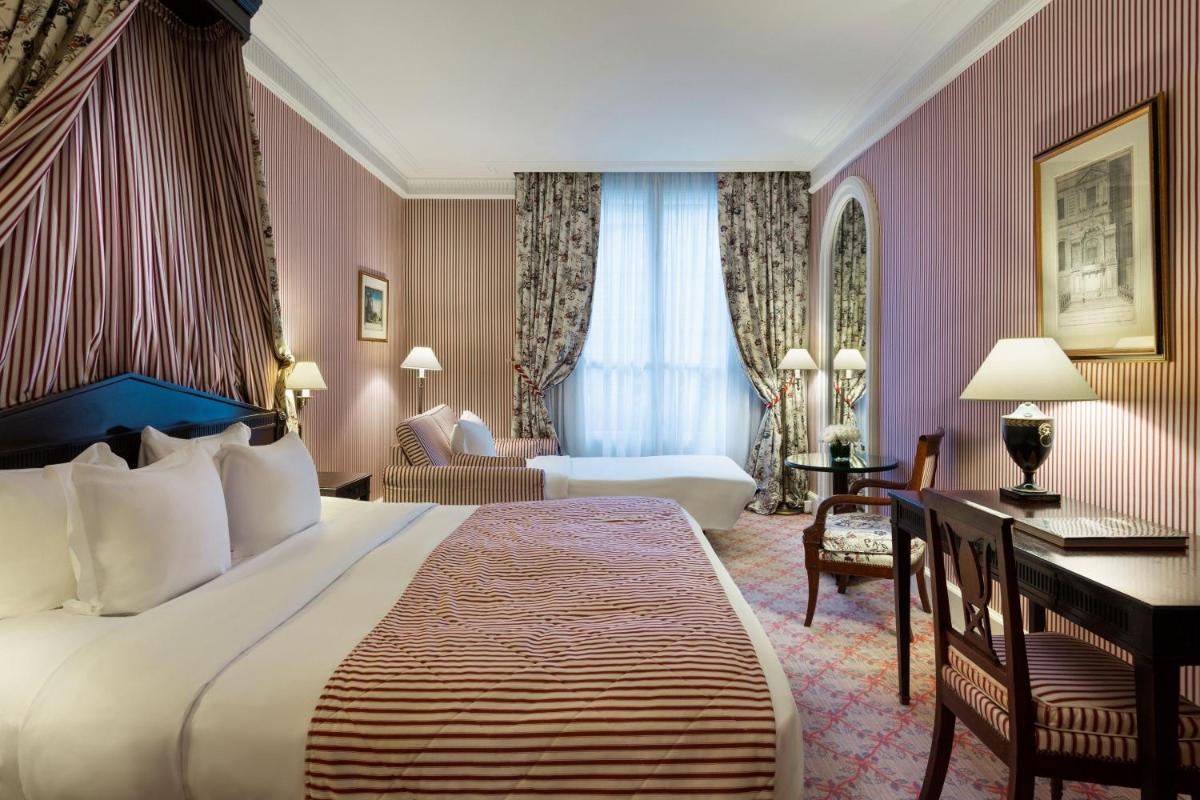 Un ou plusieurs lits dans un hébergement de l'établissement Le Dokhan's Paris Arc de Triomphe, a Tribute Portfolio Hotel