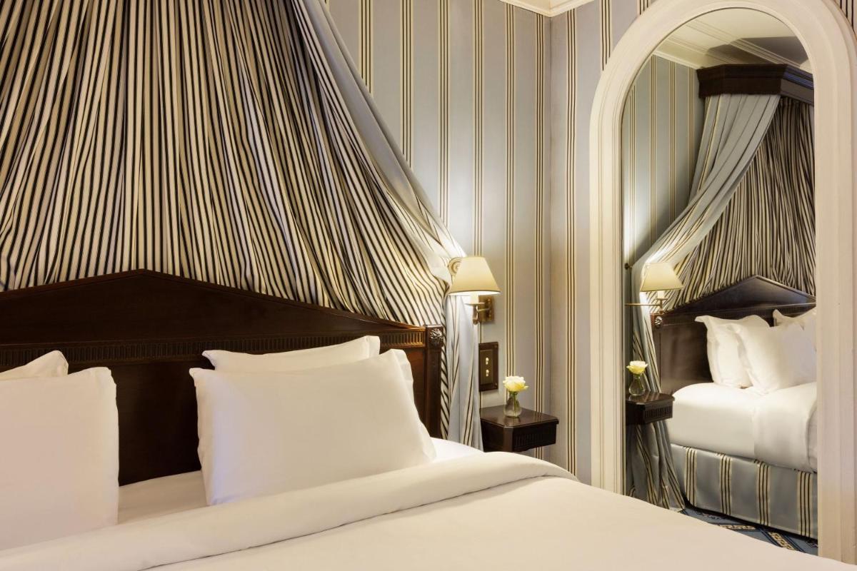 Un ou plusieurs lits dans un hébergement de l'établissement Le Dokhan's Paris Arc de Triomphe, a Tribute Portfolio Hotel