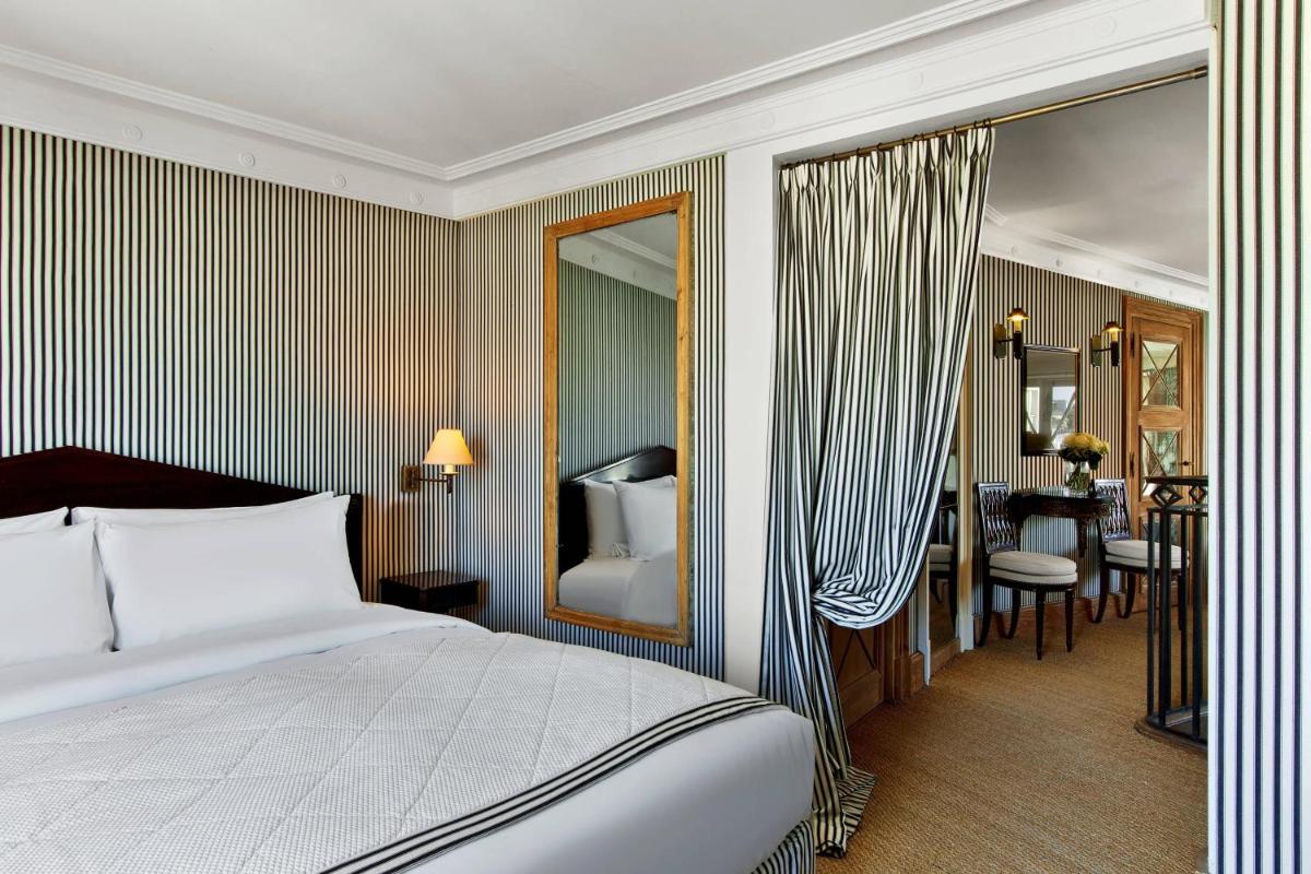 Un ou plusieurs lits dans un hébergement de l'établissement Le Dokhan's Paris Arc de Triomphe, a Tribute Portfolio Hotel