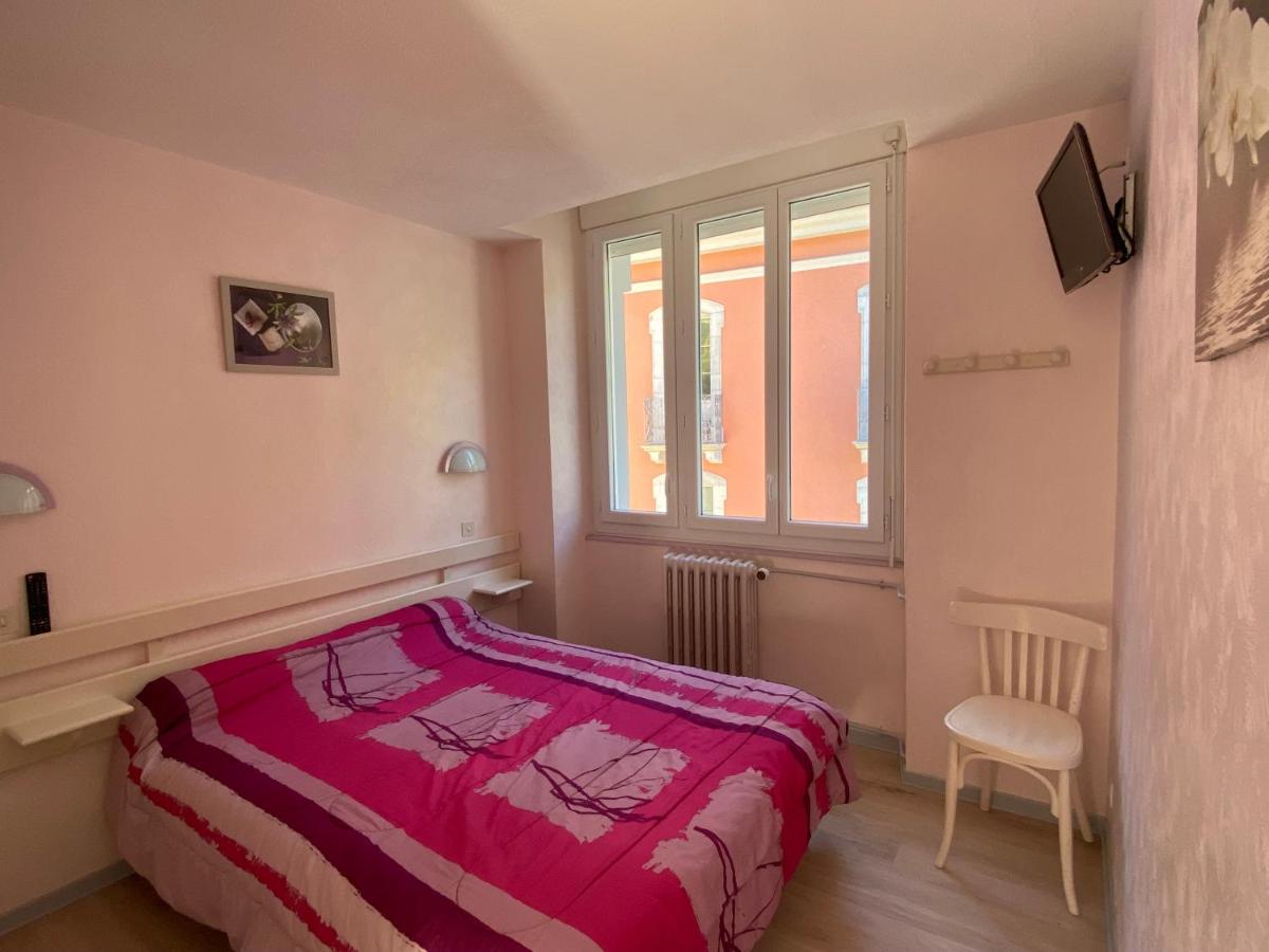 Un ou plusieurs lits dans un hébergement de l'établissement Appart Le Chili- Quartier thermal- Parc remarquable - Linge fourni