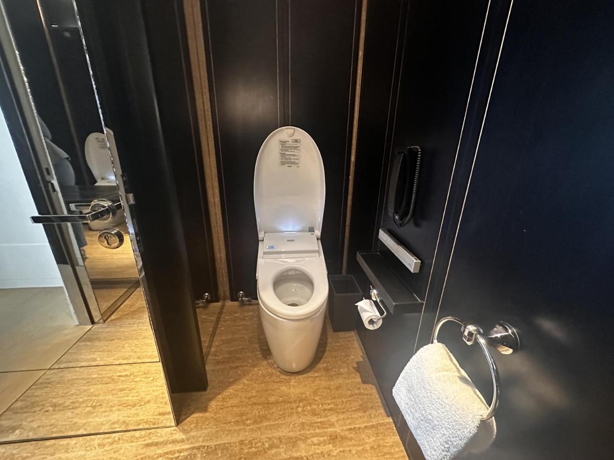 a bathroom with a toilet in a stall at Grand Hyatt Gurgaon in Gurgaon