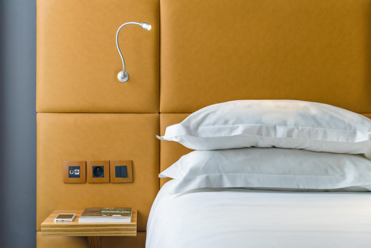 Un ou plusieurs lits dans un hébergement de l'établissement Hotel Residence Europe & Spa