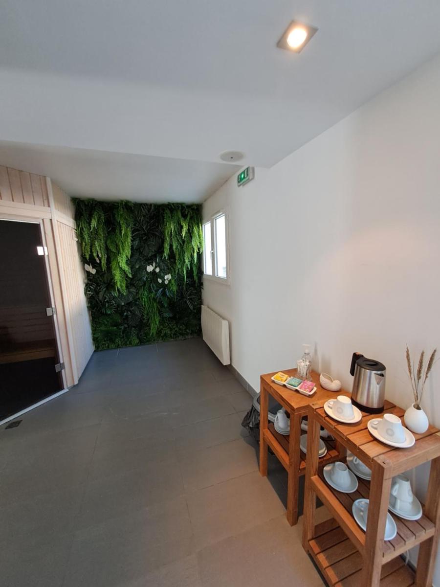 Coin salon dans l'établissement Le Churchill Hôtel & Spa