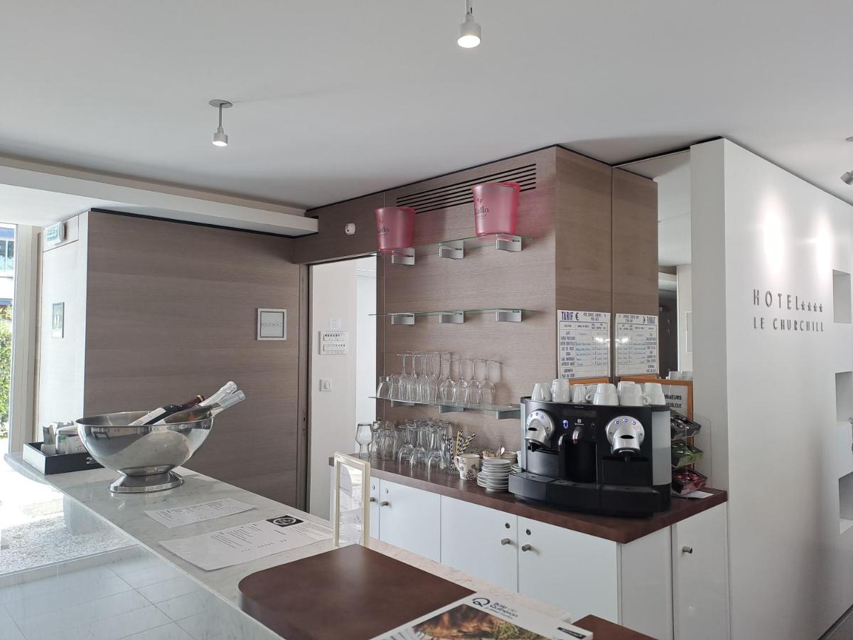 Cuisine ou kitchenette dans l'établissement Le Churchill Hôtel & Spa
