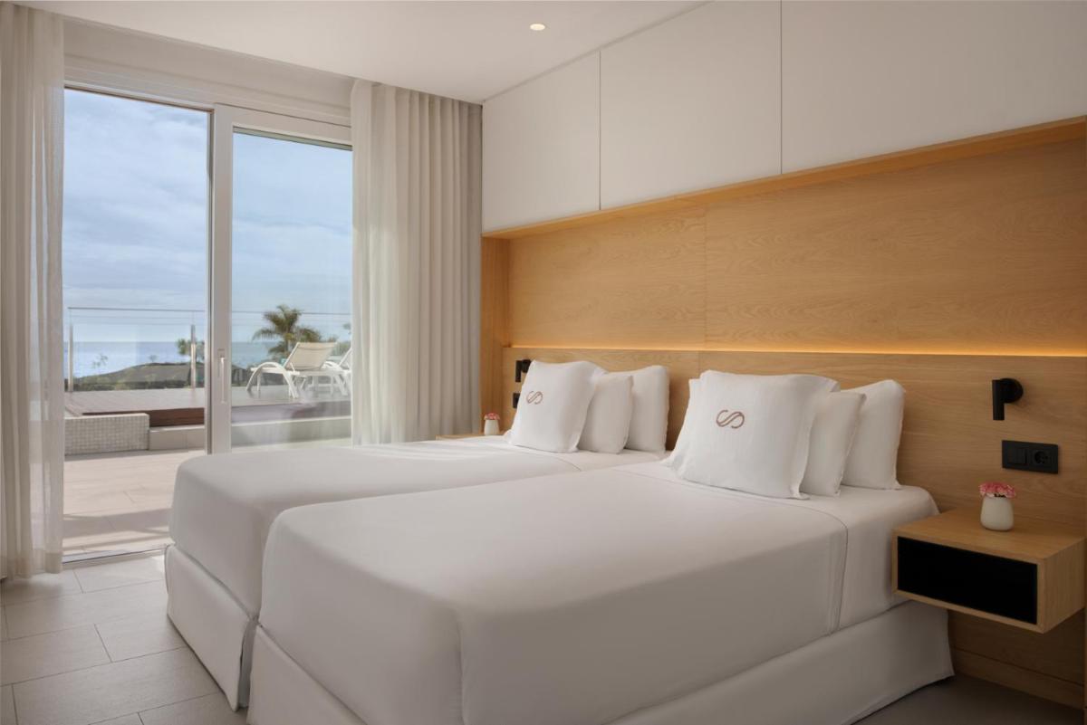 Cama o camas de una habitación en Royal Hideaway Corales Suites