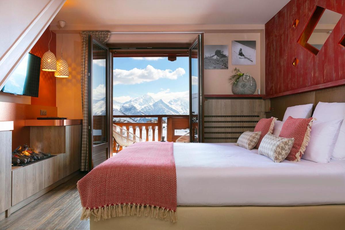 Un ou plusieurs lits dans un hébergement de l'établissement Grandes Rousses Hotel & Spa