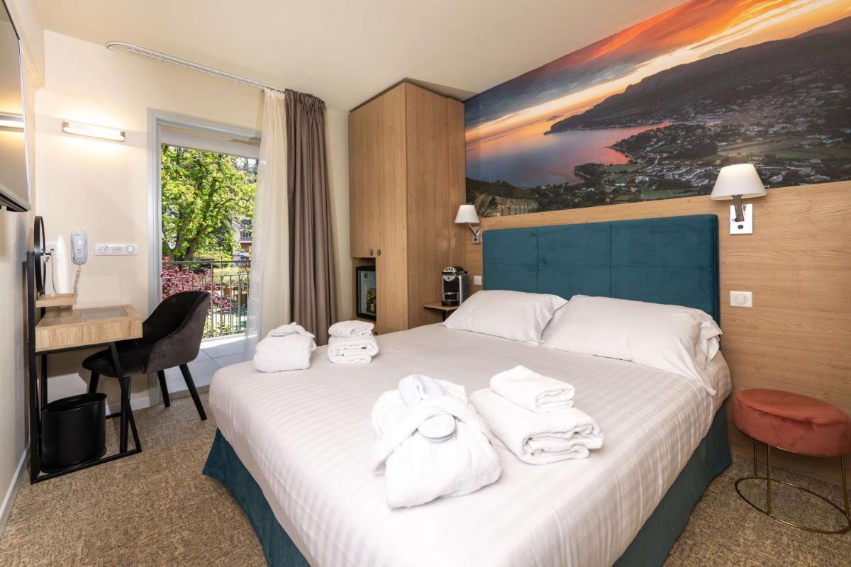 Un ou plusieurs lits dans un hébergement de l'établissement Best Western Hotel & SPA Coeur De Cassis