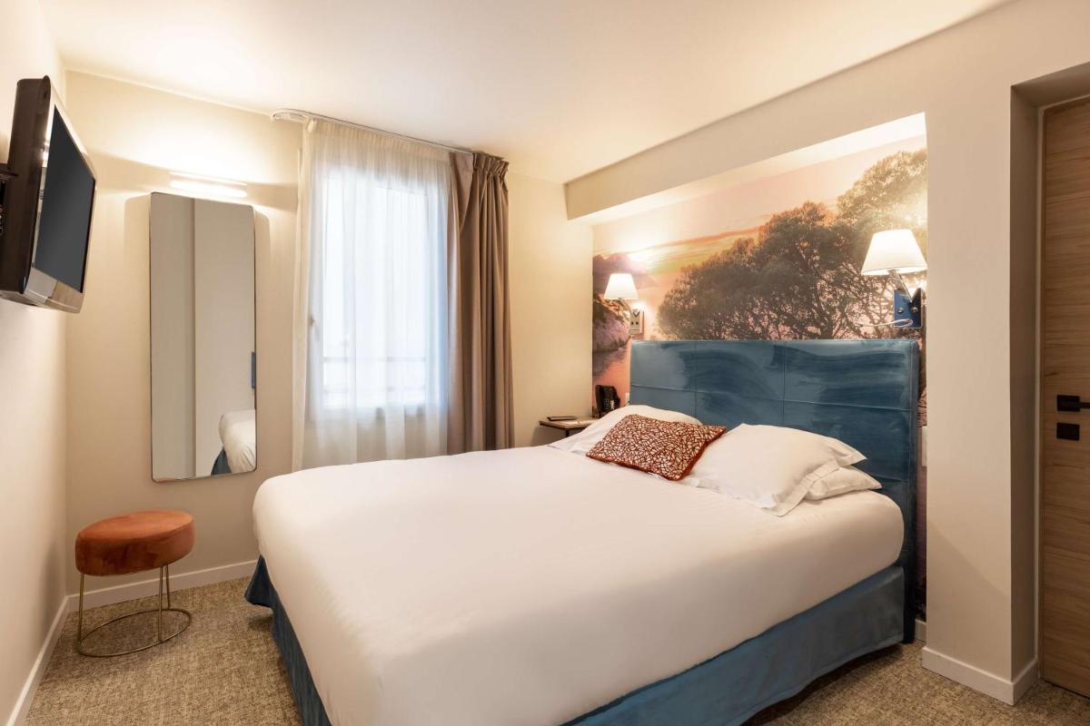 Un ou plusieurs lits dans un hébergement de l'établissement Best Western Hotel & SPA Coeur De Cassis