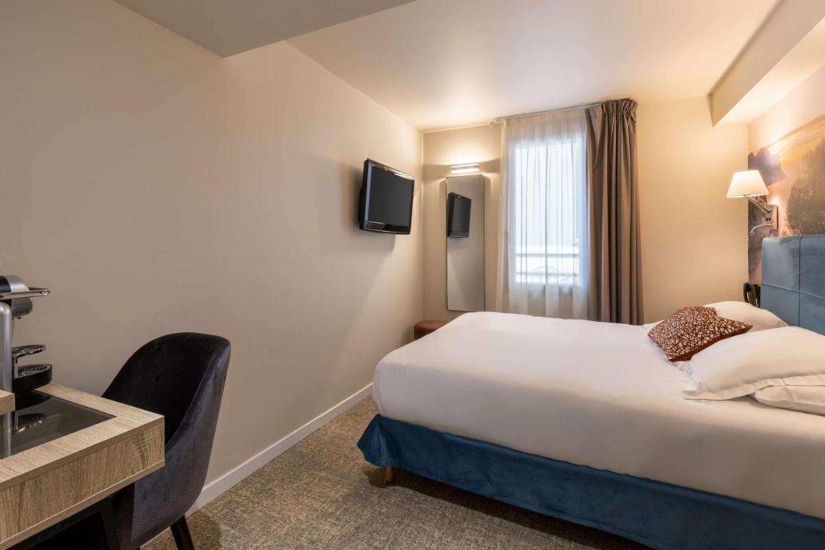 Télévision ou salle de divertissement dans l'établissement Best Western Hotel & SPA Coeur De Cassis