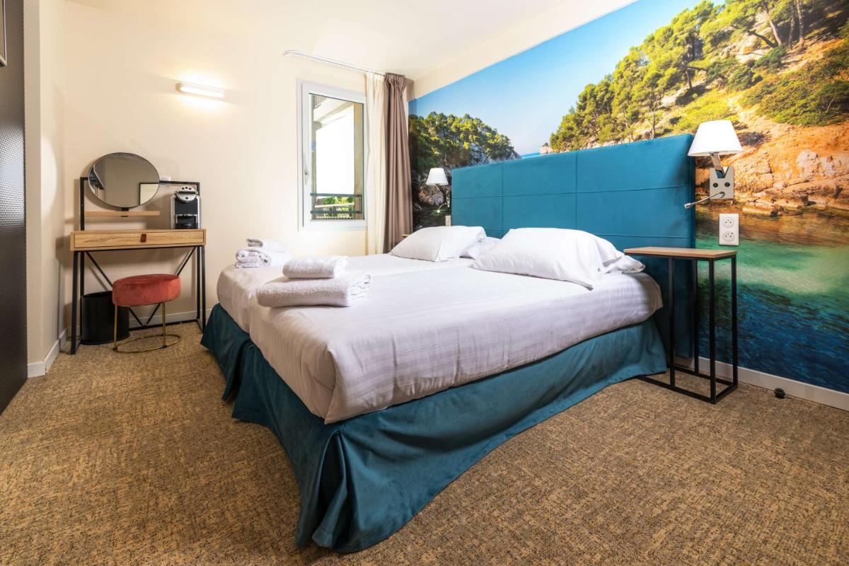 Un ou plusieurs lits dans un hébergement de l'établissement Best Western Hotel & SPA Coeur De Cassis
