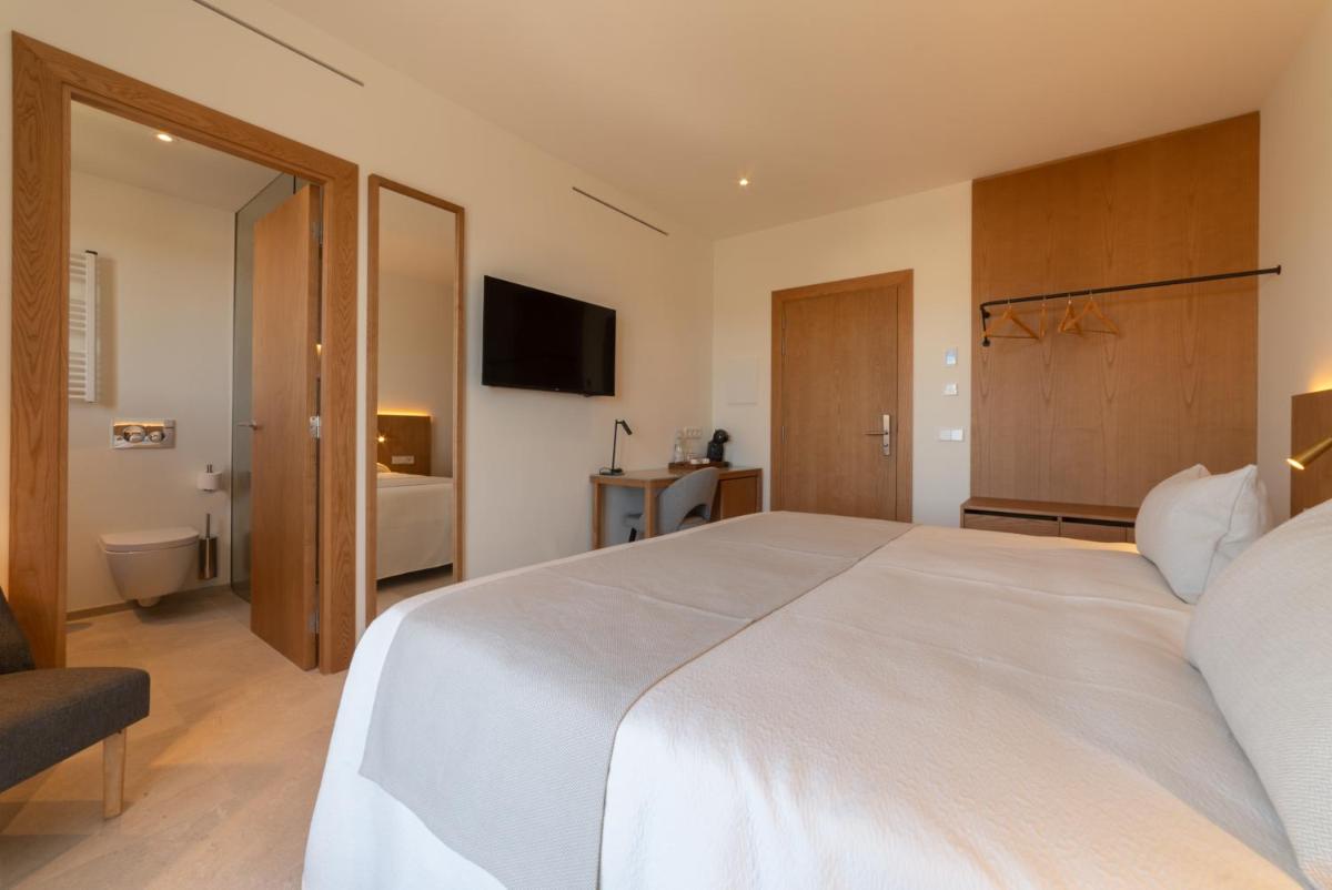 Cama o camas de una habitación en Nema Boutique Hotel & Spa