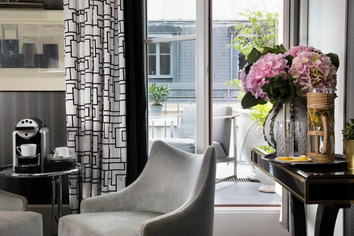 Coin salon dans l'établissement Hôtel Baume