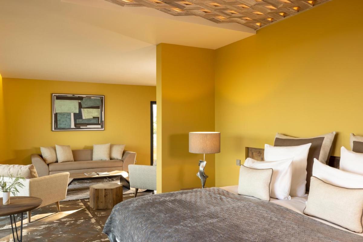 Coin salon dans l'établissement Les Regalia Hôtel & Spa