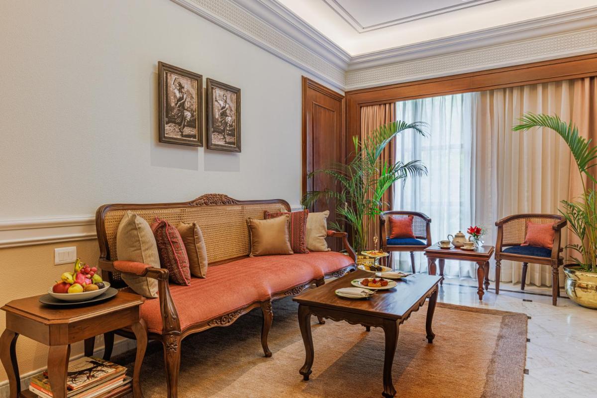a living room with a couch and a table at Raajkutir - IHCL SeleQtions in Kolkata