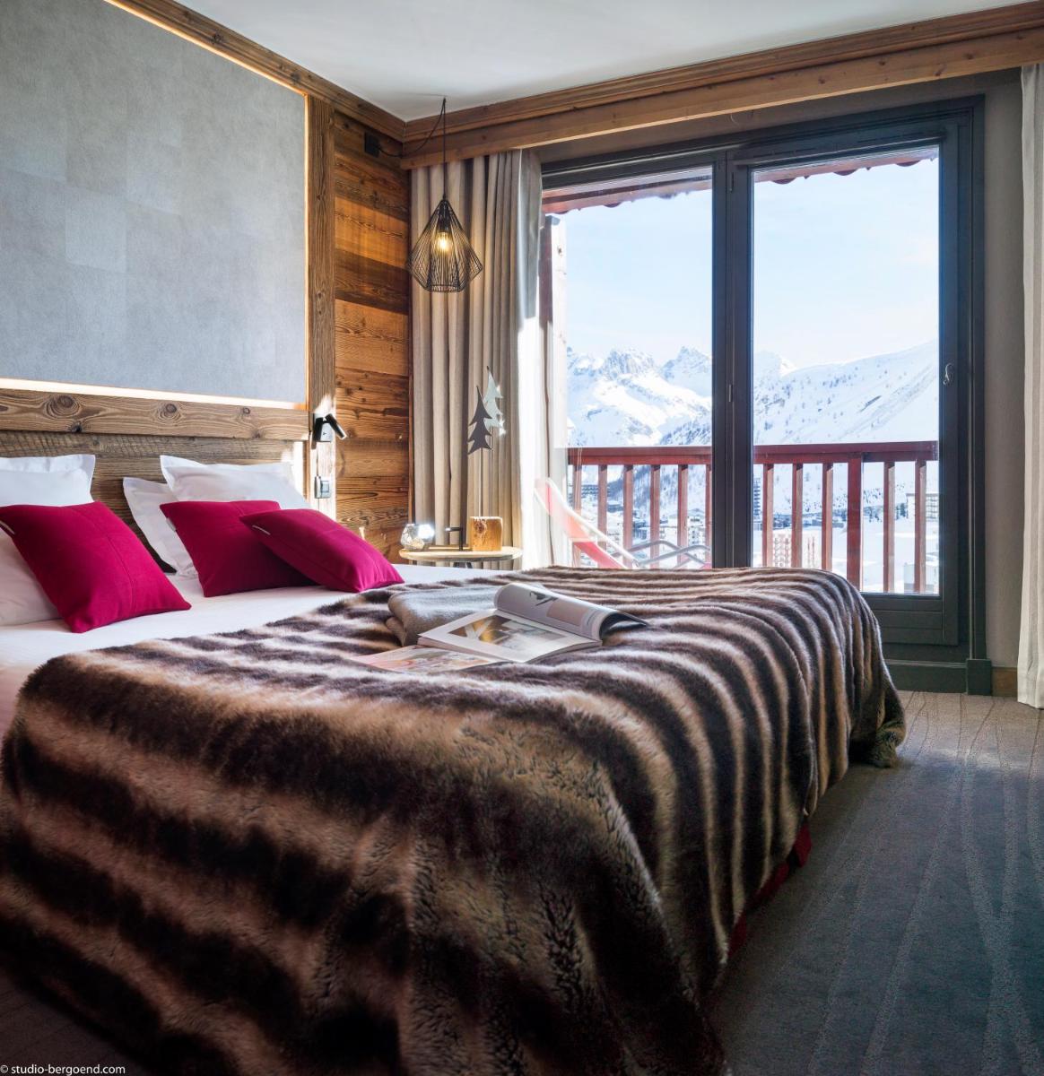Un ou plusieurs lits dans un hébergement de l'établissement Hôtel Village Montana by Les Etincelles