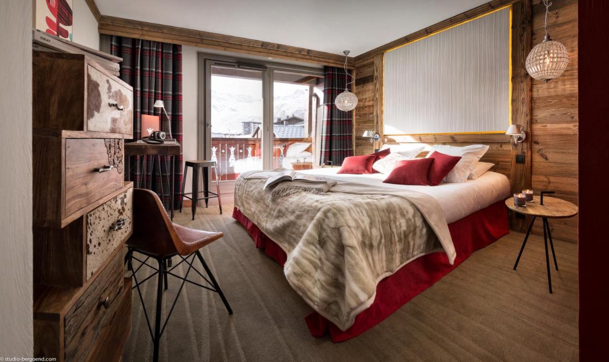 Un ou plusieurs lits dans un hébergement de l'établissement Hôtel Village Montana by Les Etincelles