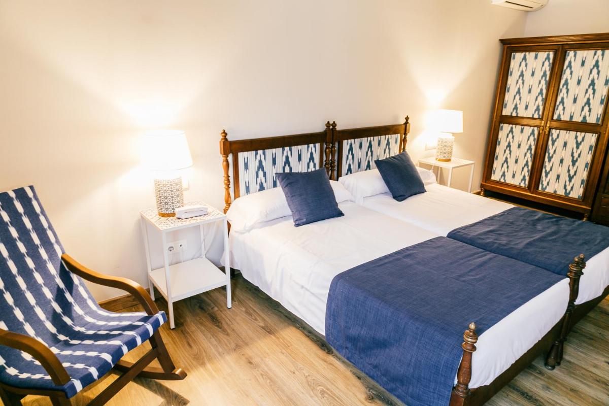 Cama o camas de una habitación en Hotel El Guía