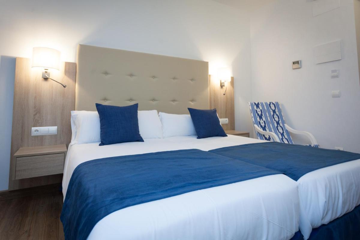Cama o camas de una habitación en Hotel El Guía