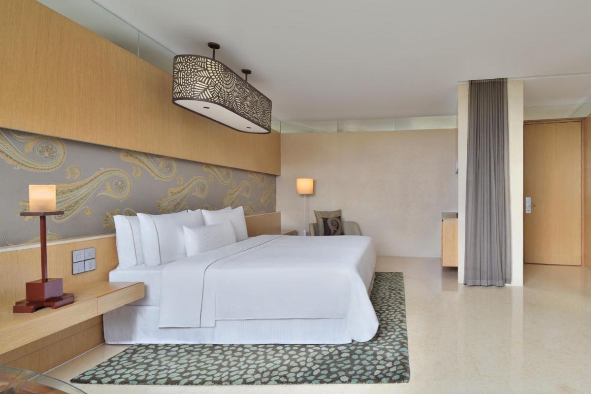 a bedroom with a large white bed in a room at The Westin Gurgaon, New Delhi in Gurgaon