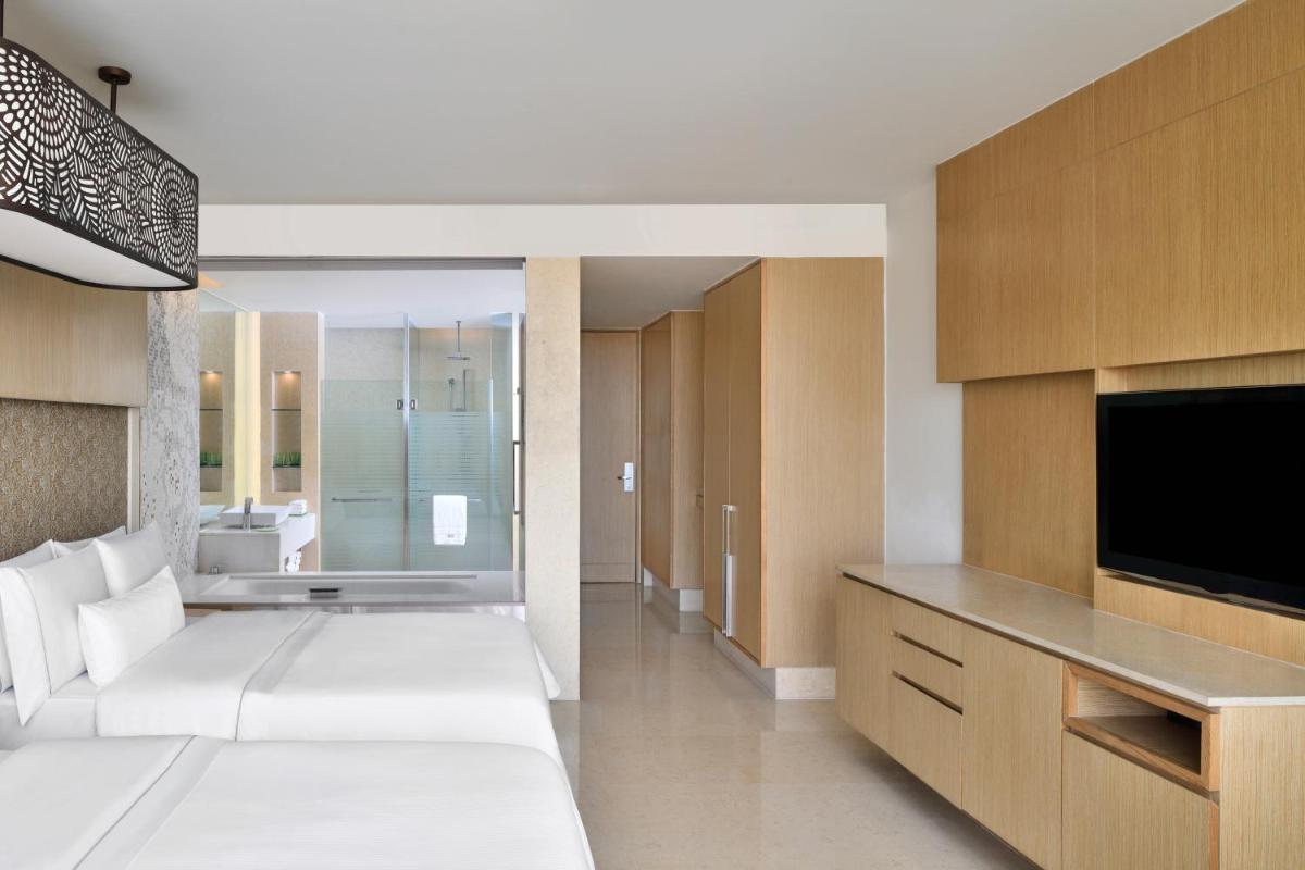 a hotel room with a bed and a television at The Westin Gurgaon, New Delhi in Gurgaon
