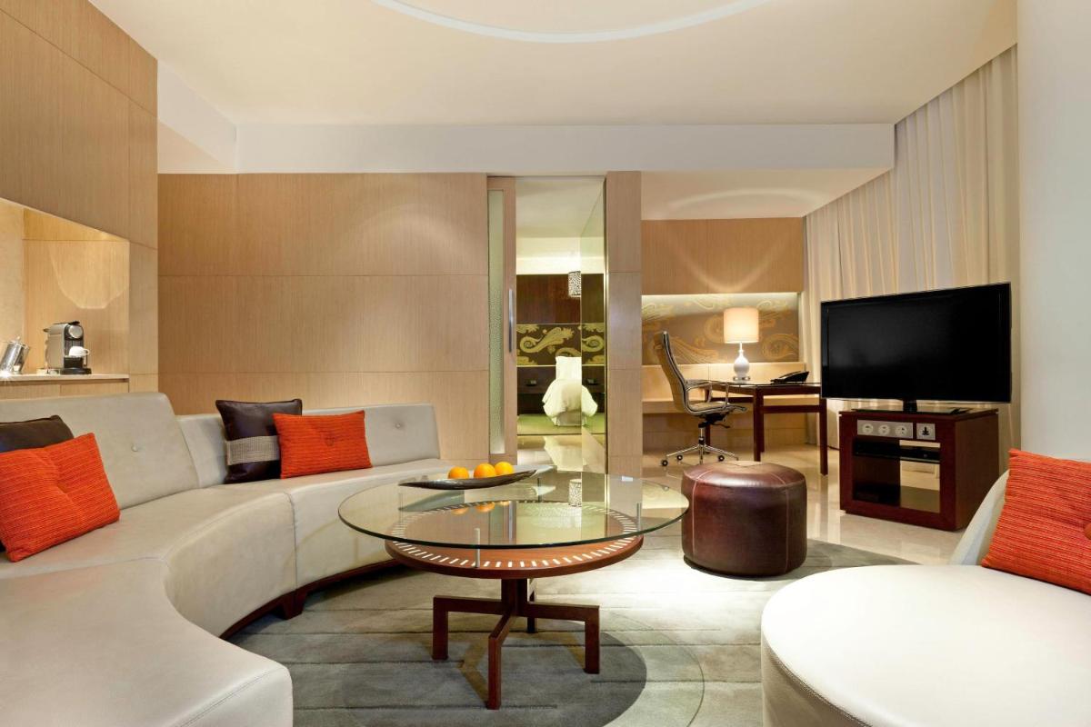 a living room with a couch and a table at The Westin Gurgaon, New Delhi in Gurgaon